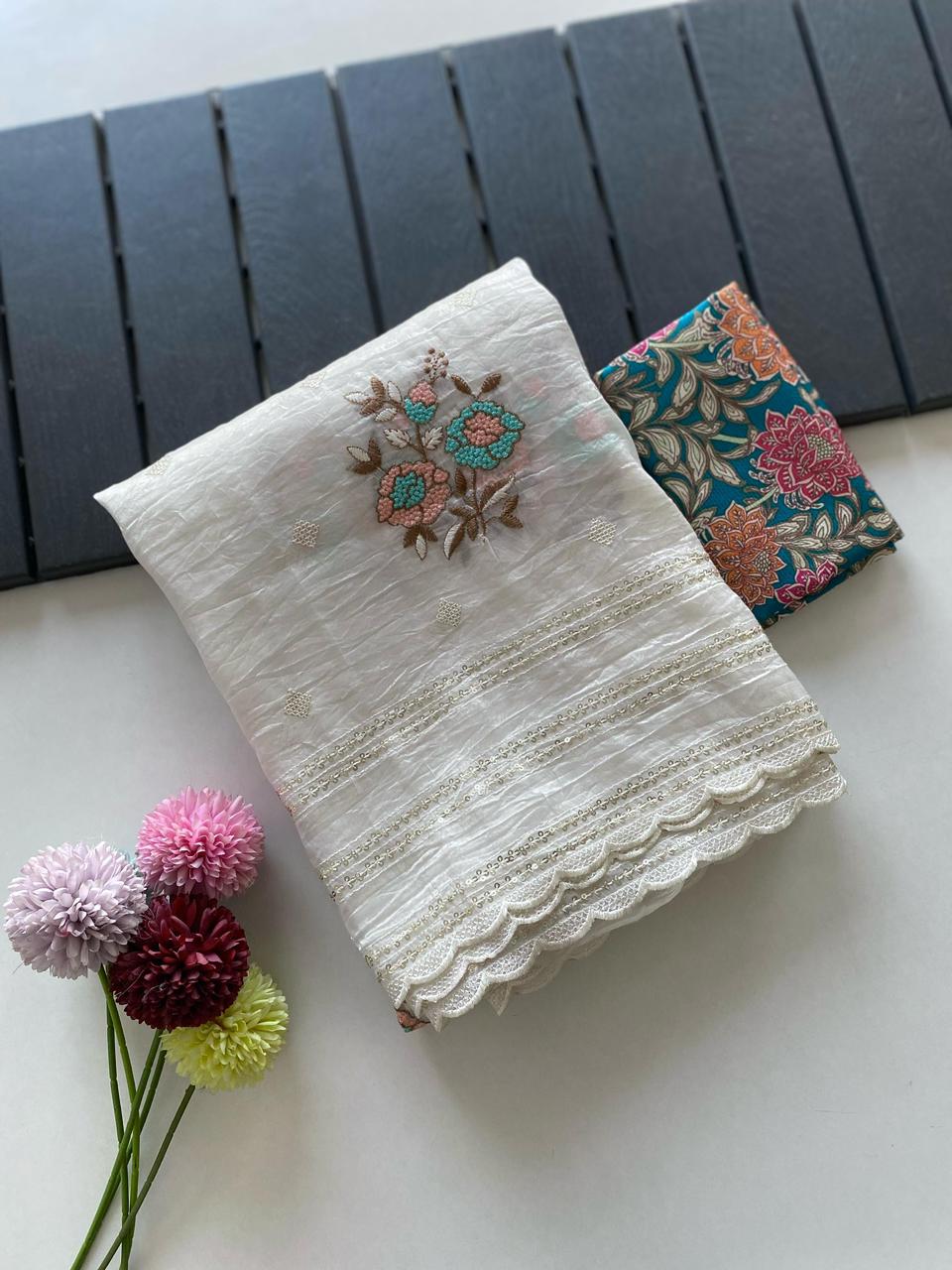 Crunchy ciffon saree with elegant scalap and thread embroidery work.