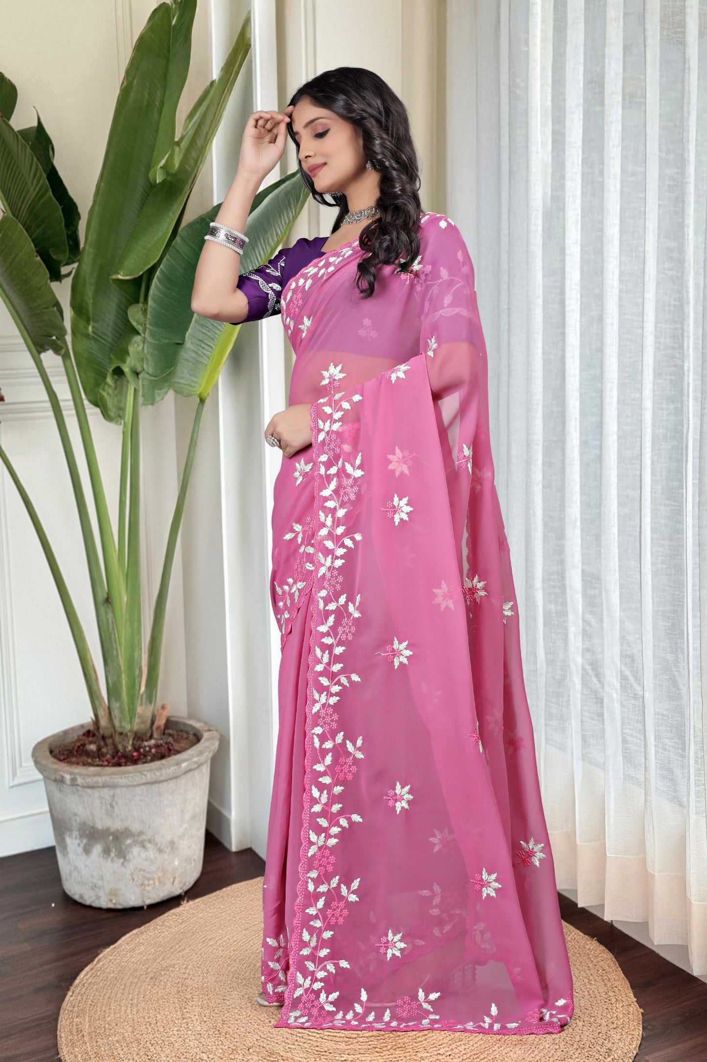 Georgette with floral design embroidery with scalloped cutwork border Saree