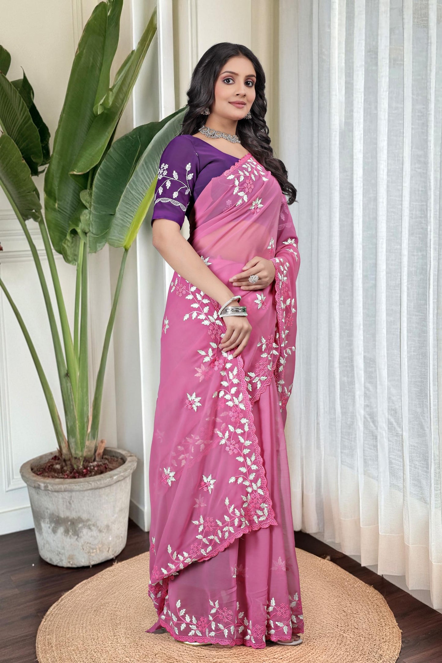 Georgette with floral design embroidery with scalloped cutwork border Saree