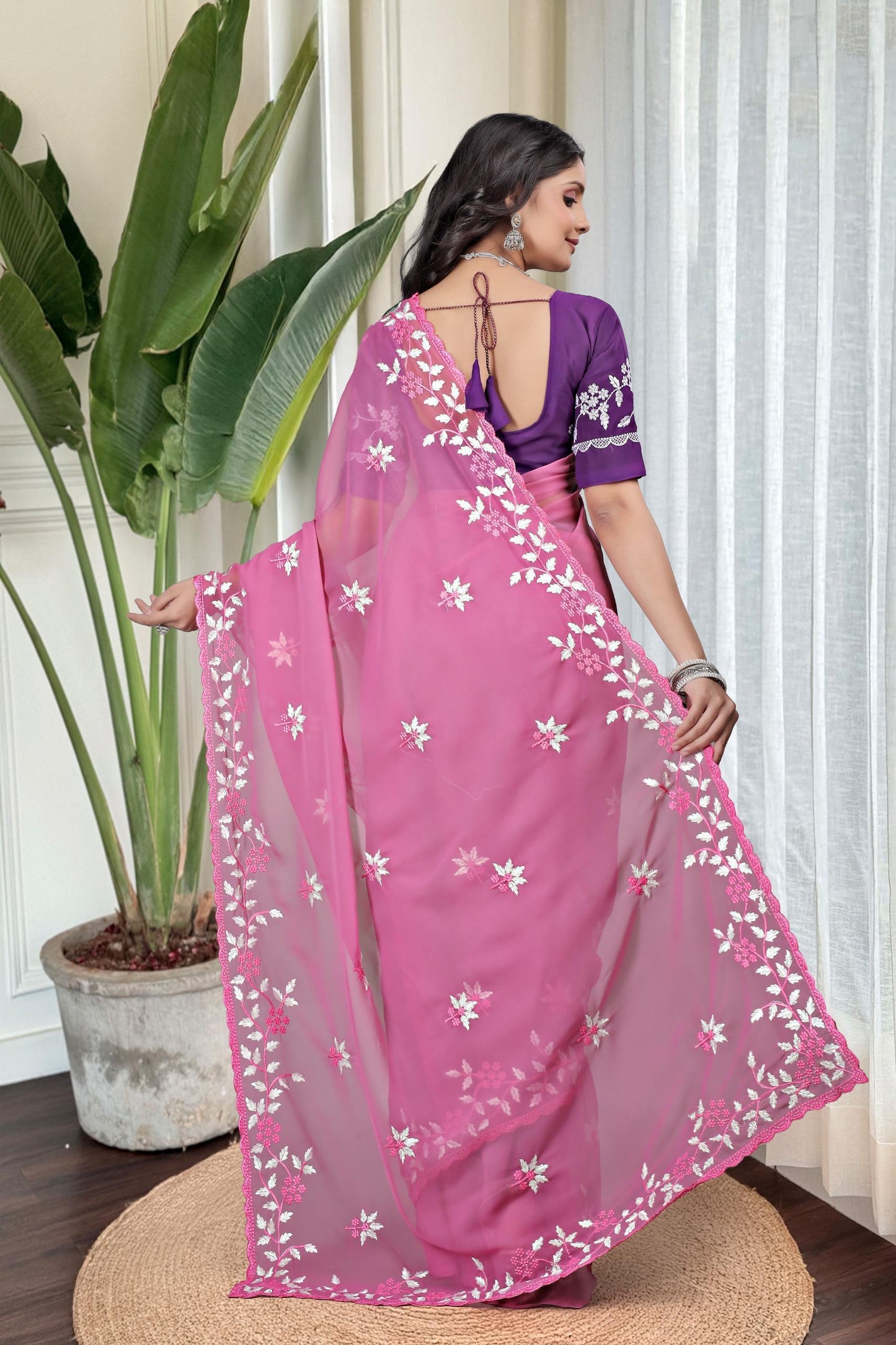 Georgette with floral design embroidery with scalloped cutwork border Saree