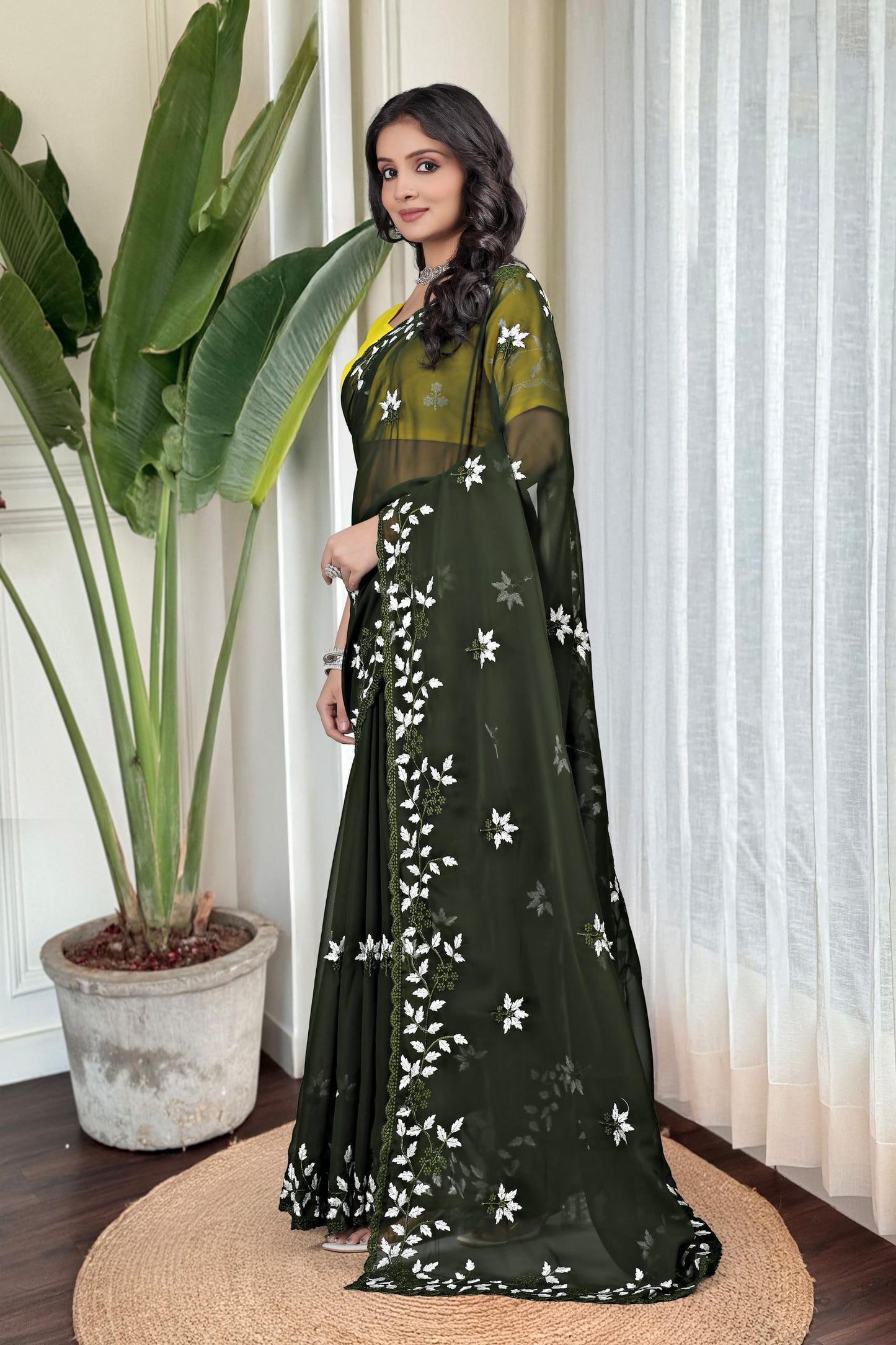Georgette with floral design embroidery with scalloped cutwork border Saree