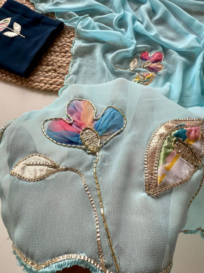 Soft Georgette Fabric With Beautiful Floral Patch Work And Embossed Cutwork Border Saree