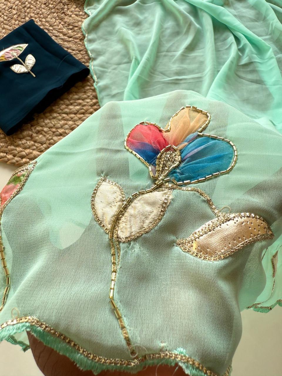 Soft Georgette Fabric With Beautiful Floral Patch Work And Embossed Cutwork Border Saree