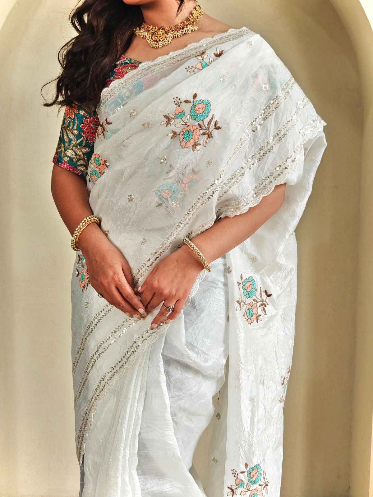 Crunchy ciffon saree with elegant scalap and thread embroidery work.