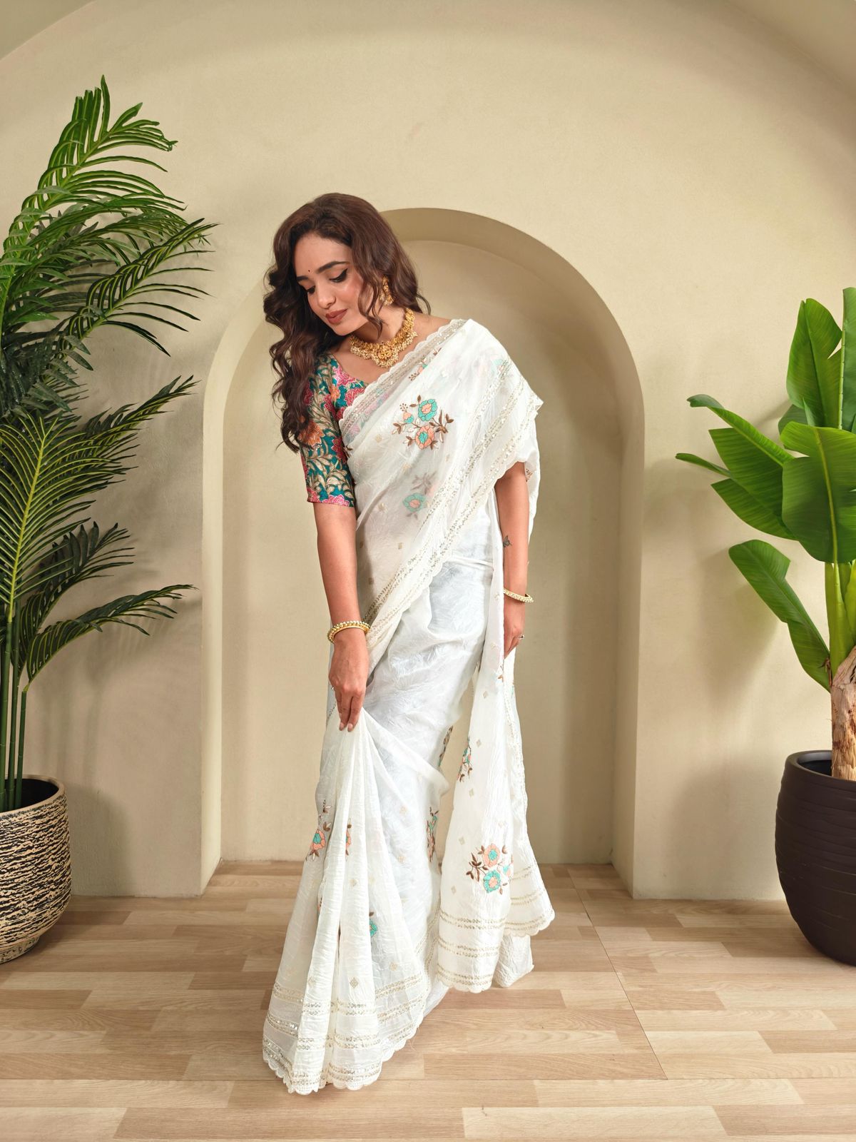 Crunchy ciffon saree with elegant scalap and thread embroidery work.