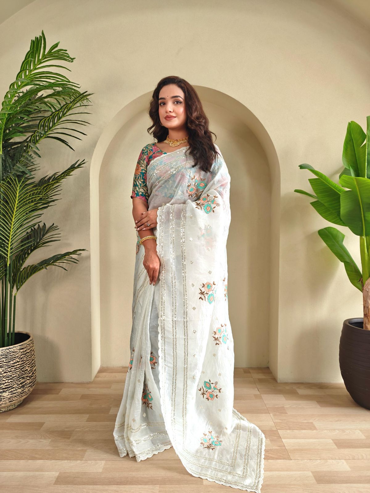 Crunchy ciffon saree with elegant scalap and thread embroidery work.